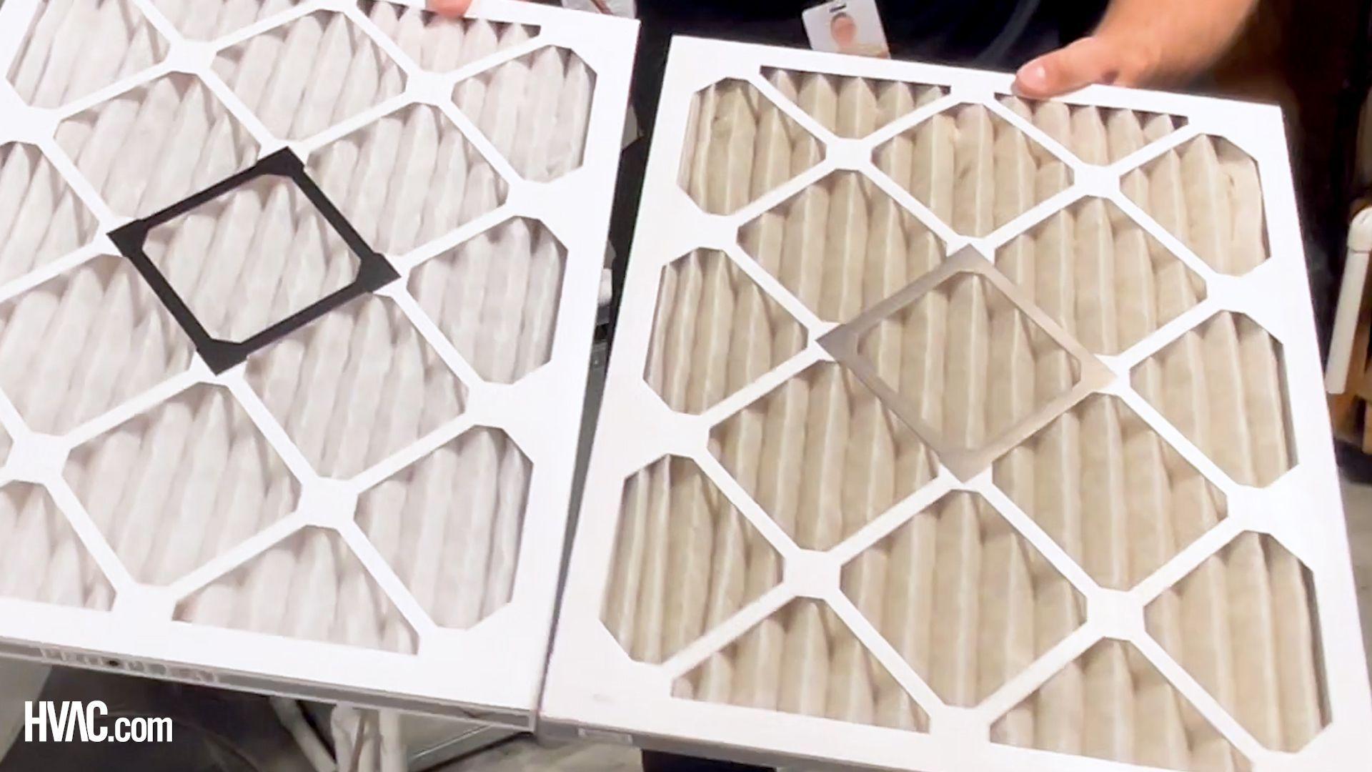 Picture of a dirty HVAC filter next to a clean one