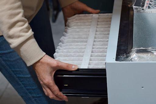 Man changing HVAC air filter