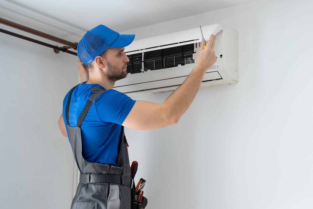 HVAC technician installing ductless mini split