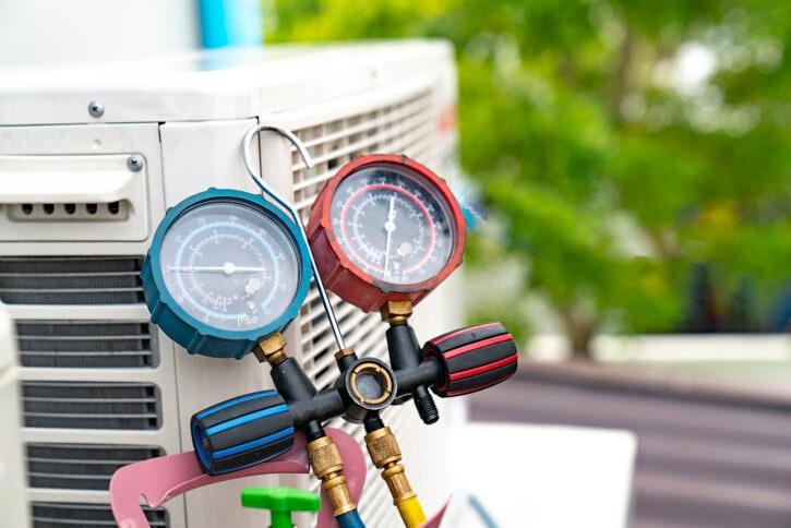 Technician is checking air conditioner
