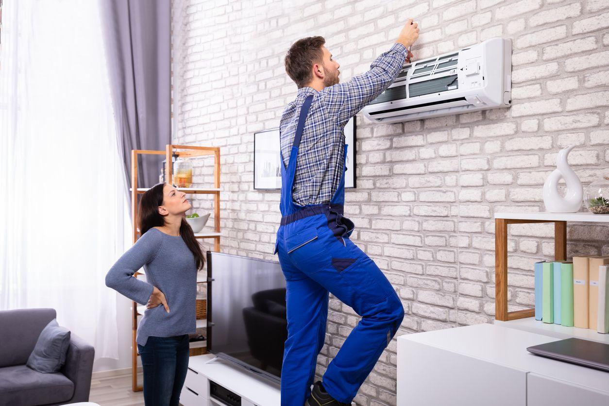 HVAC technician working in home