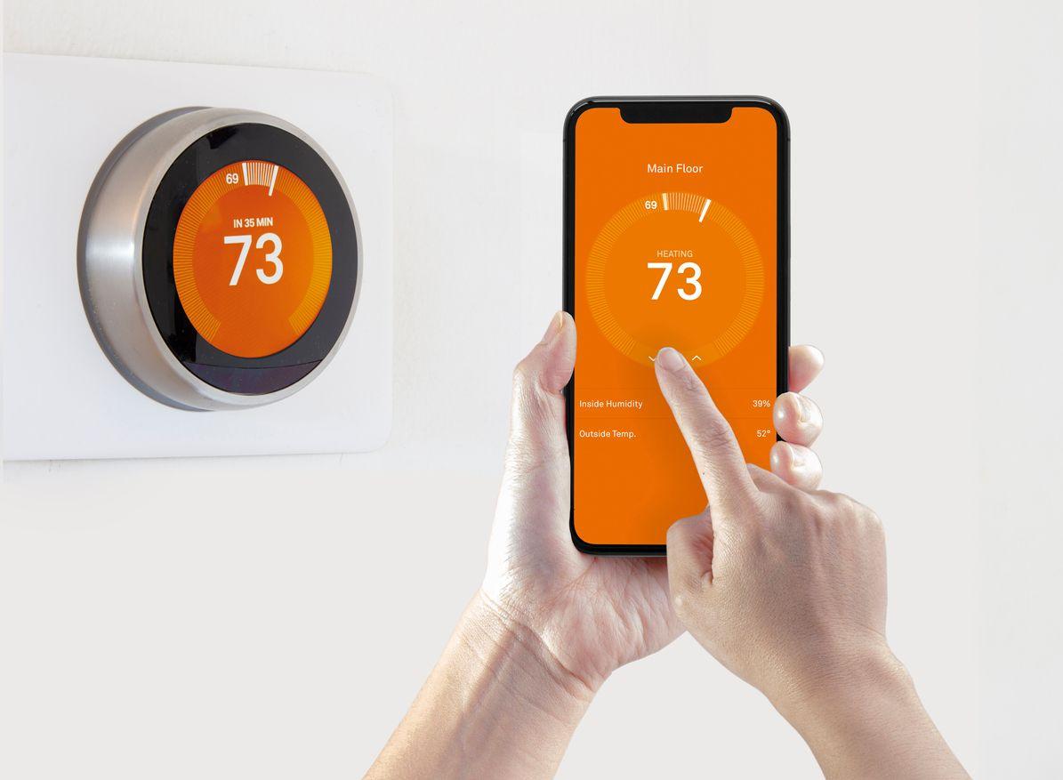 Homeowner using a smart thermostat
