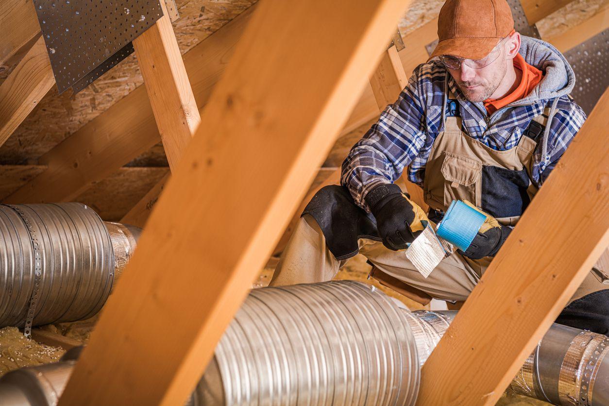 HVAC contractor installing air ducts