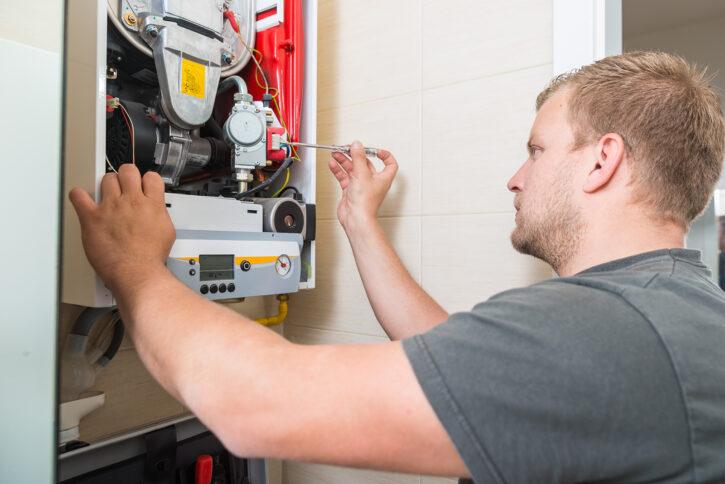 Technician repairing Gas Furnace