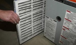 installing furnace filter into furnace