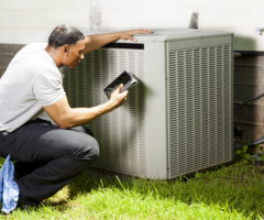  guy checks hvac system for repair work