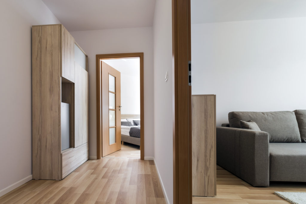 two modern rooms in house with wood