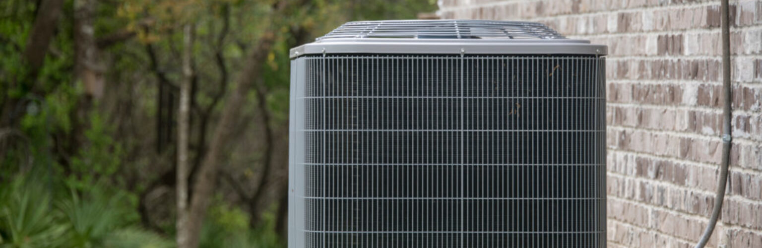 one ac unit next to a house