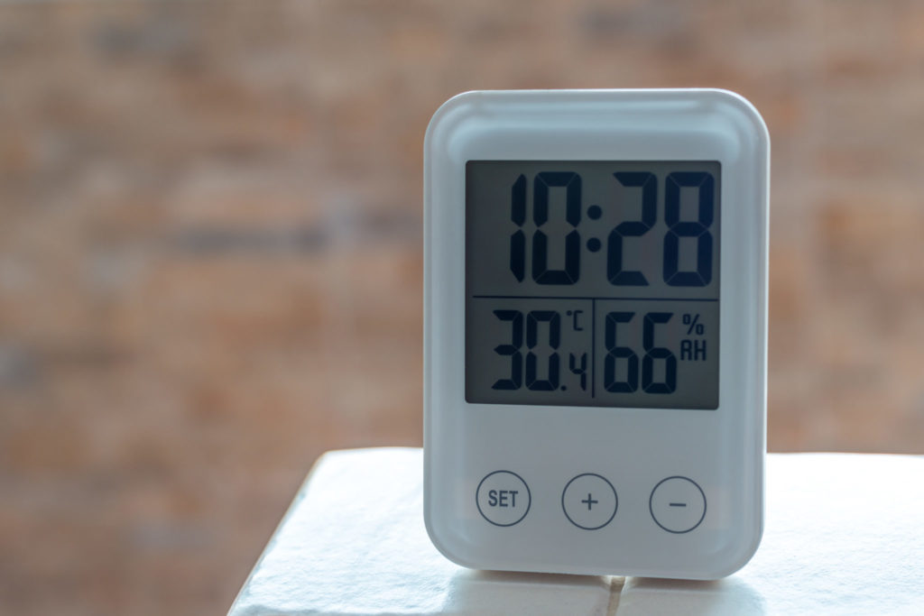 clock with humidity sensor on table