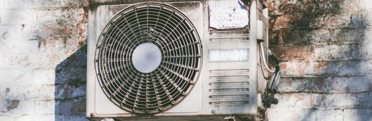 ac unit on a dirty wall