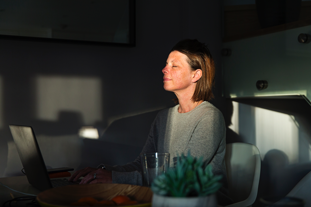 woman-breathing-deeply-in-home