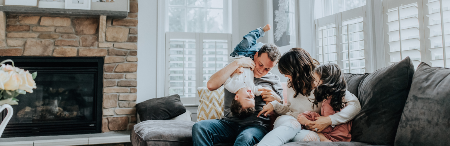 family cozy on the couch