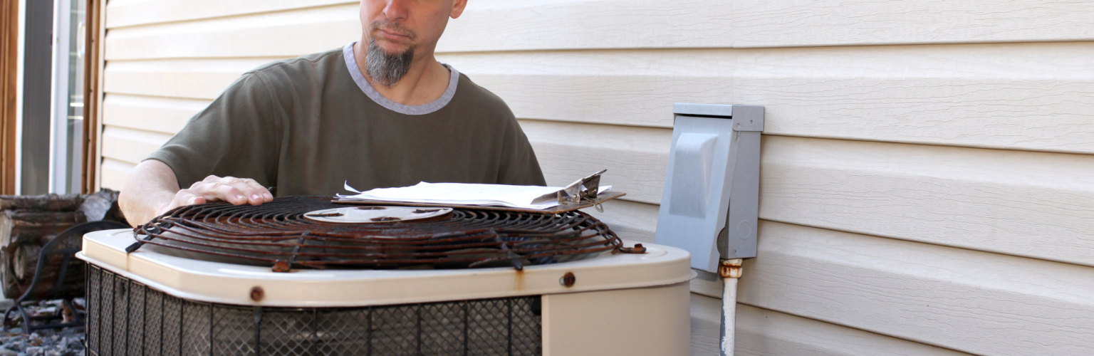 person checking ac unit