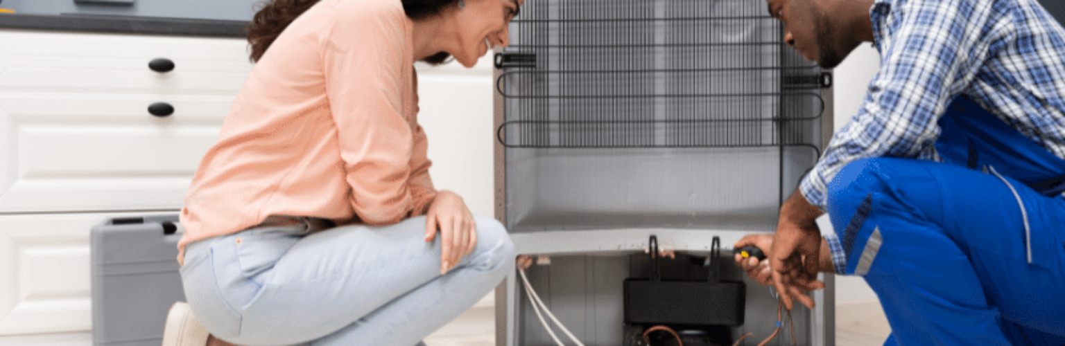 man and woman checking air conditioning unit