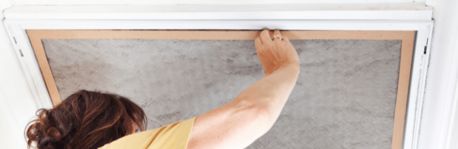 woman changing the air filter