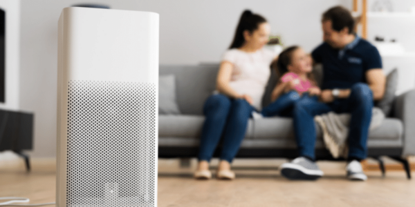 family in large room with air purifier
