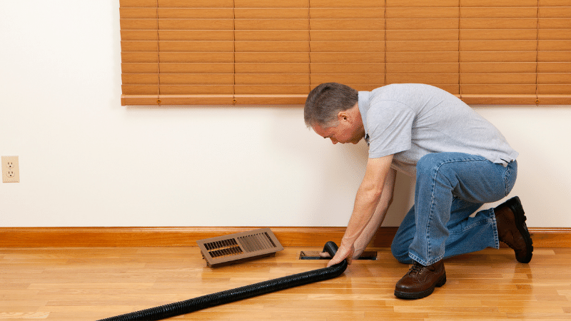 man cleaning air ducts