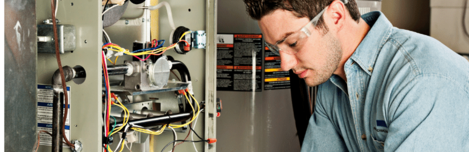 repairman looking at furnace