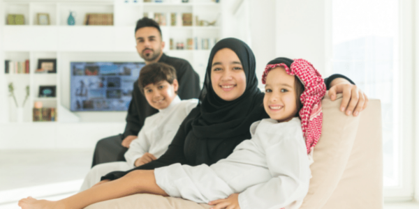 family sitting on couch