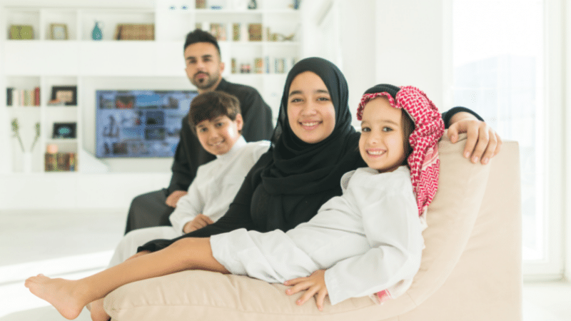 family sitting on couch