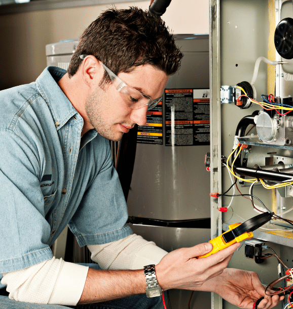 hvac repair technician fixing furnace